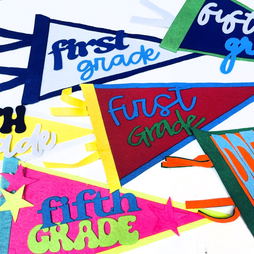 Colorful 'first grade' and 'fifth grade' pennant flags 